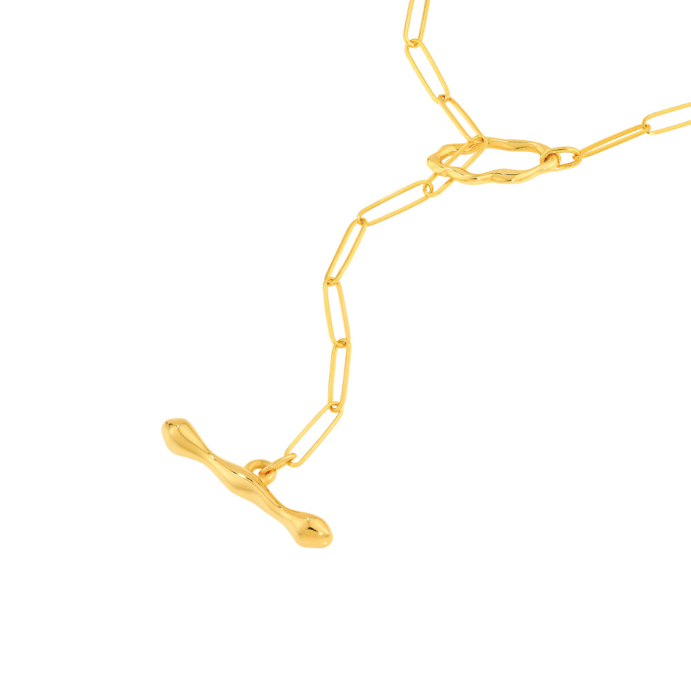 gold tone lariat style necklace on white background