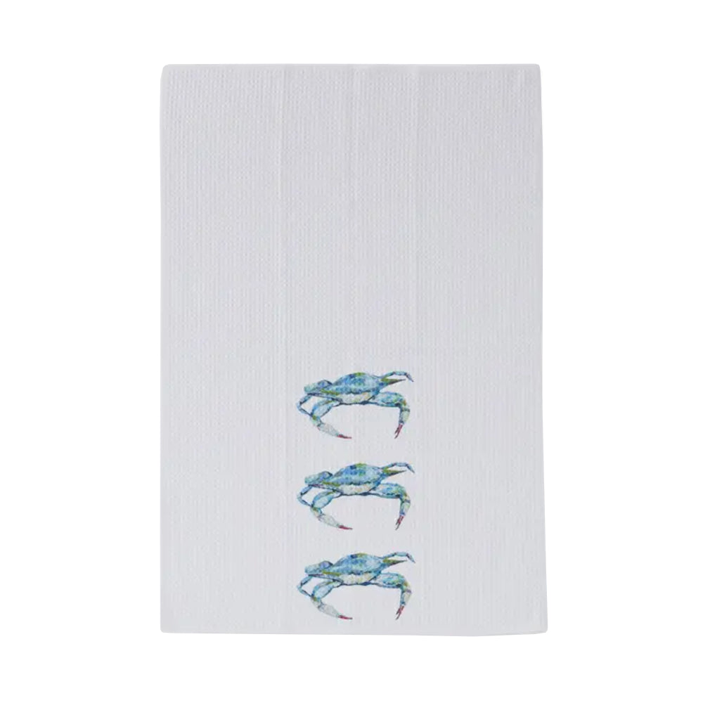 White towel with embroidered blue crabs on a white background
