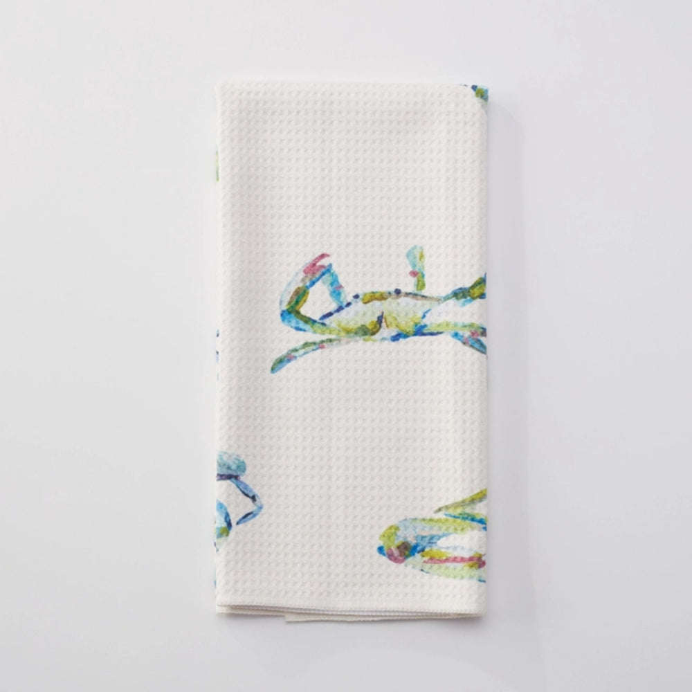 White waffle-textured towel with colorful crab design on a light gray background