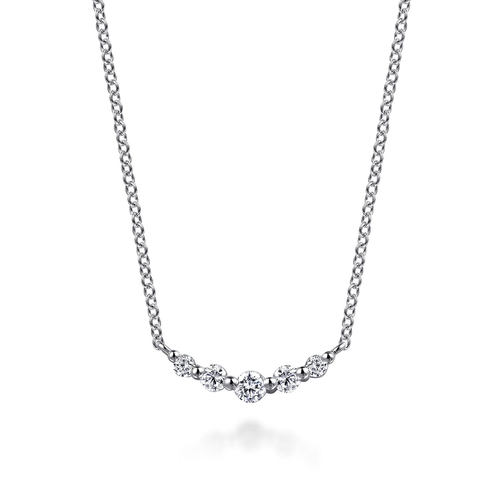 white gold necklace with white stones on white background