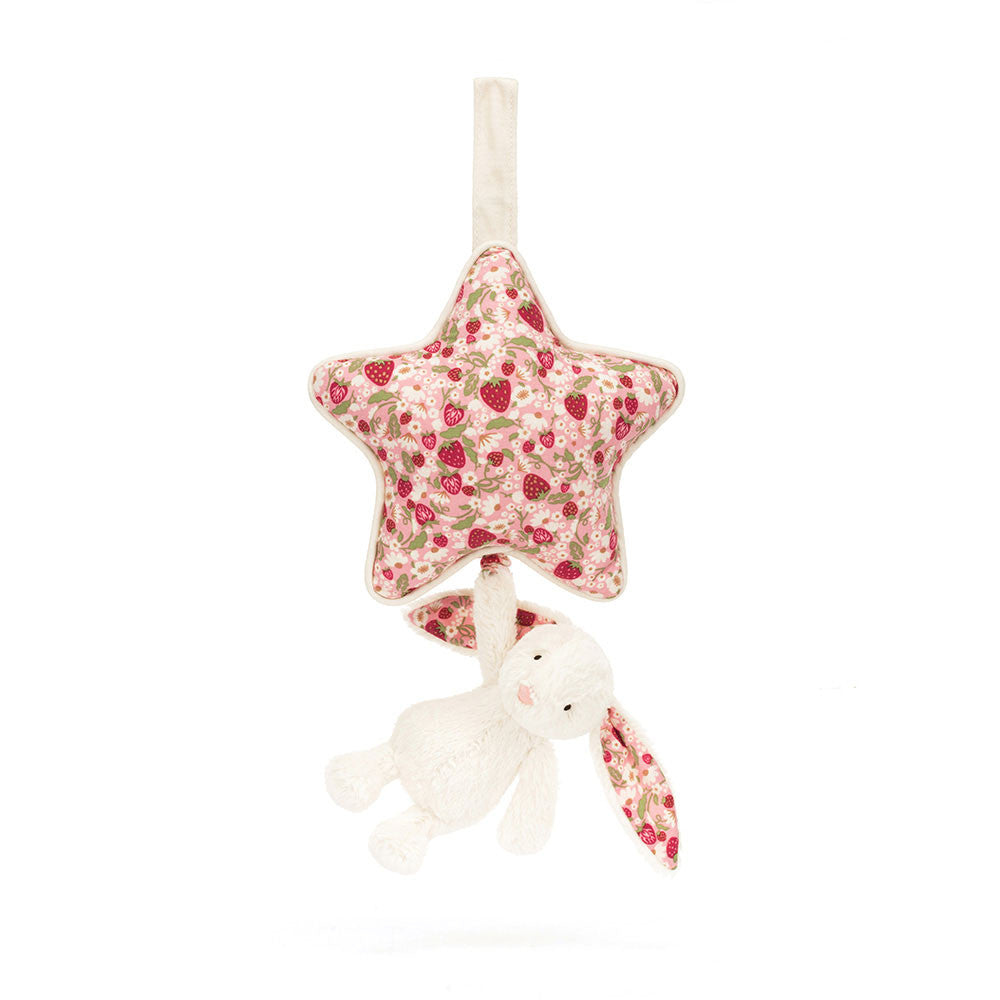 Star-shaped fabric rattle with a pink  floral pattern and white bunny on a white background.