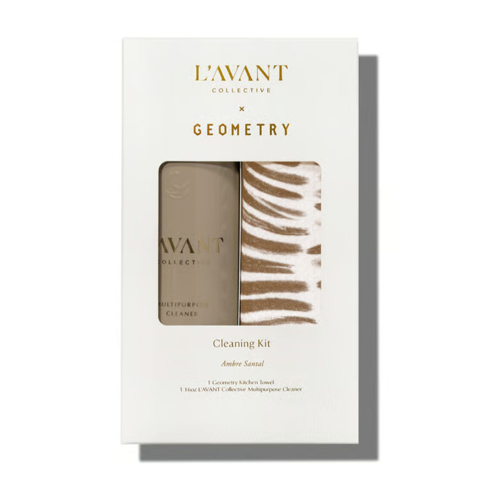 L'Avant Collective x Geometry Cleaning Kit in Amber Sandal scent, shown in its white packaging box with a clear window displaying the amber-colored cleanser and the patterned sponge.