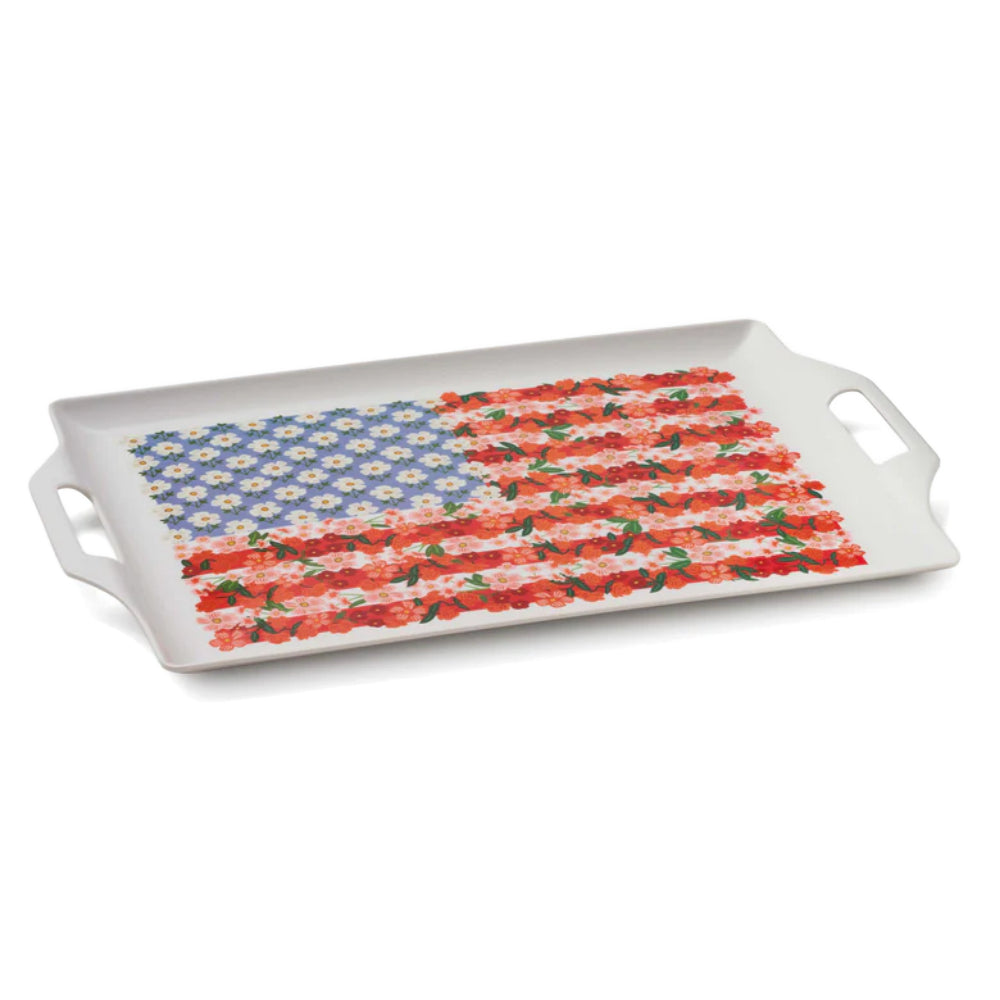 A angled side photo of a white rectangular tray with an American flag floral design on a white background.