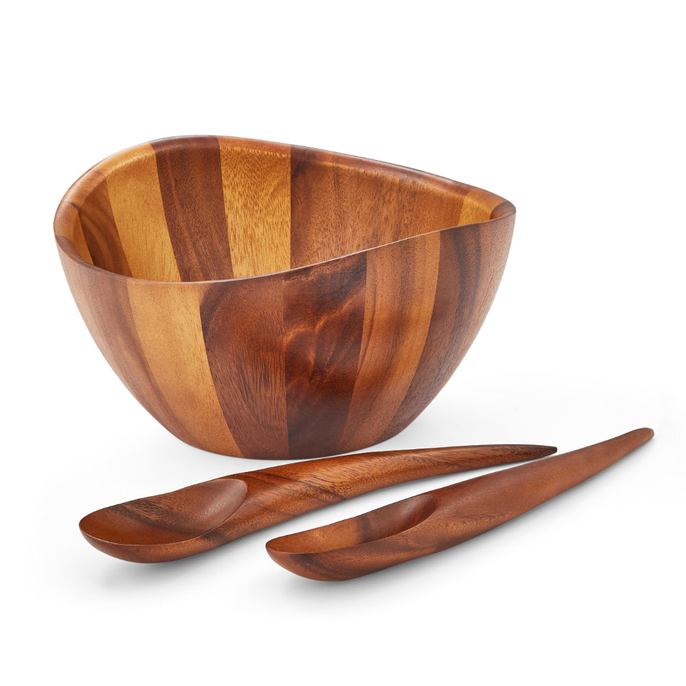 Wooden bowl and two wooden spoons on a white background