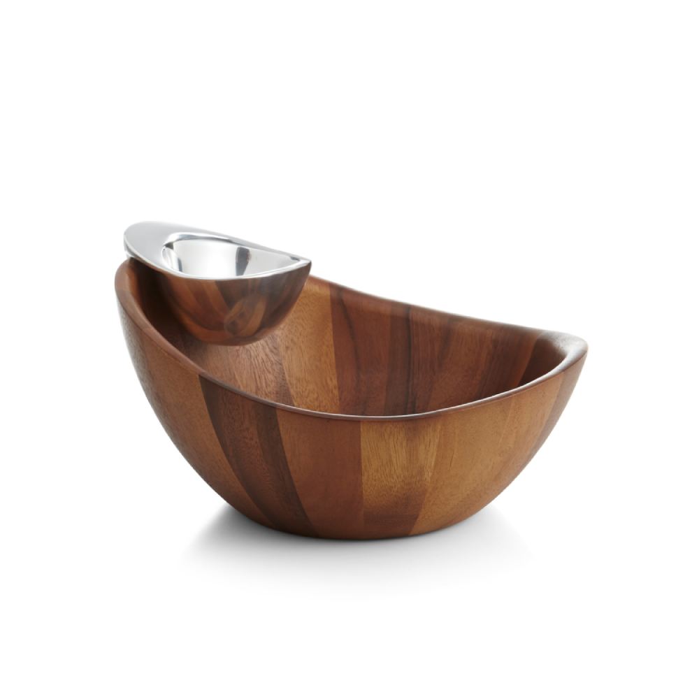 A two-piece Nambé Harmony Chip & Dip serving bowl set, with a larger bowl made of Acacia wood and a smaller alloy bowl inside for serving dips on a white backround.