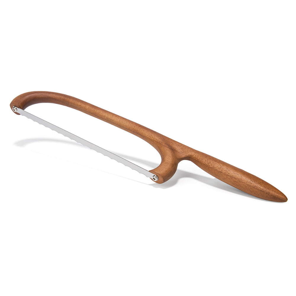 Wooden-handled bread saw on a white background