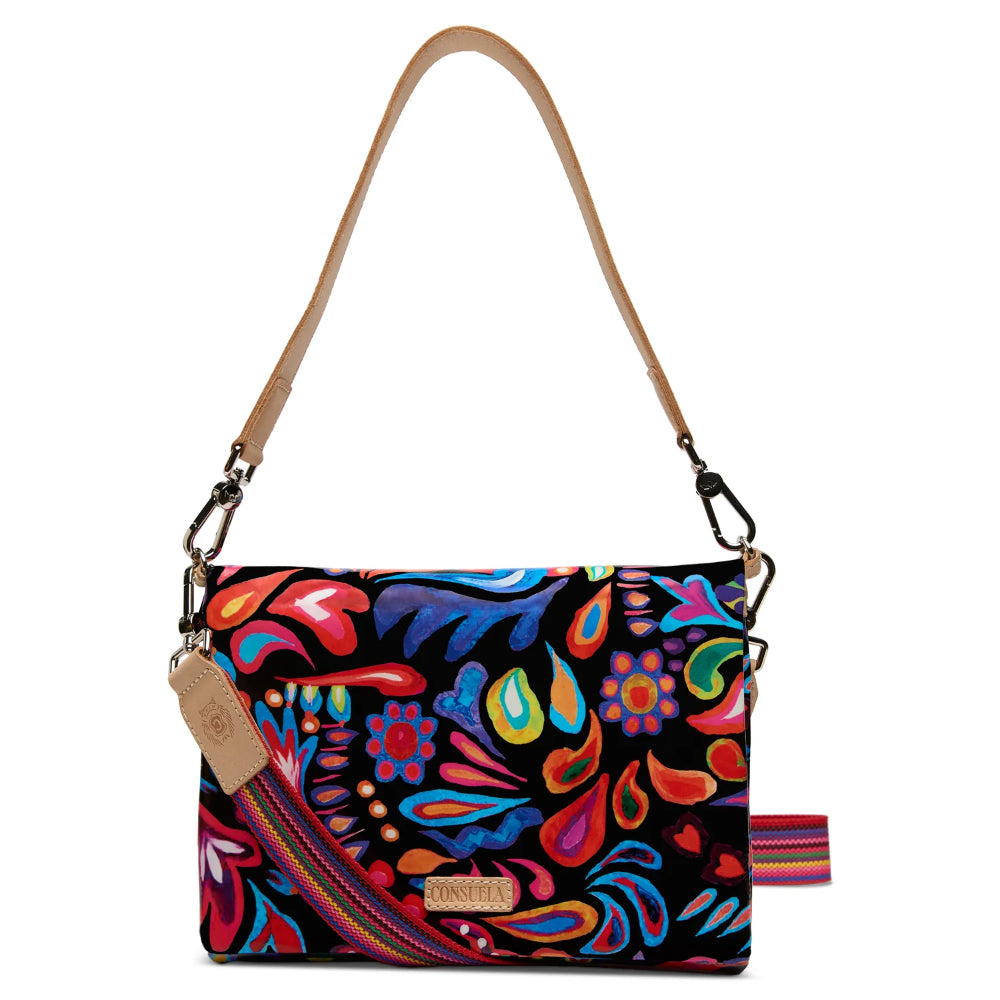 Colorful patterned handbag with a strap on a white background