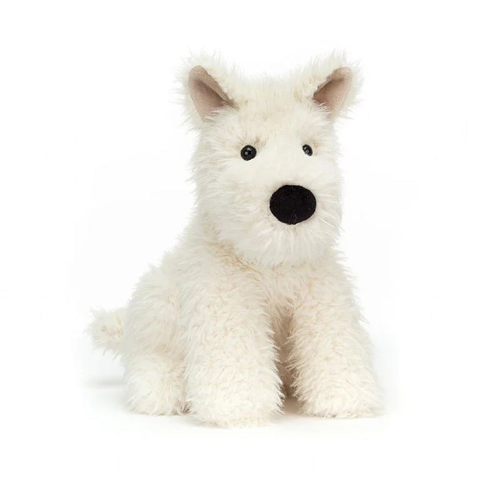 An angled side photo of a white plush dog toy on a white background