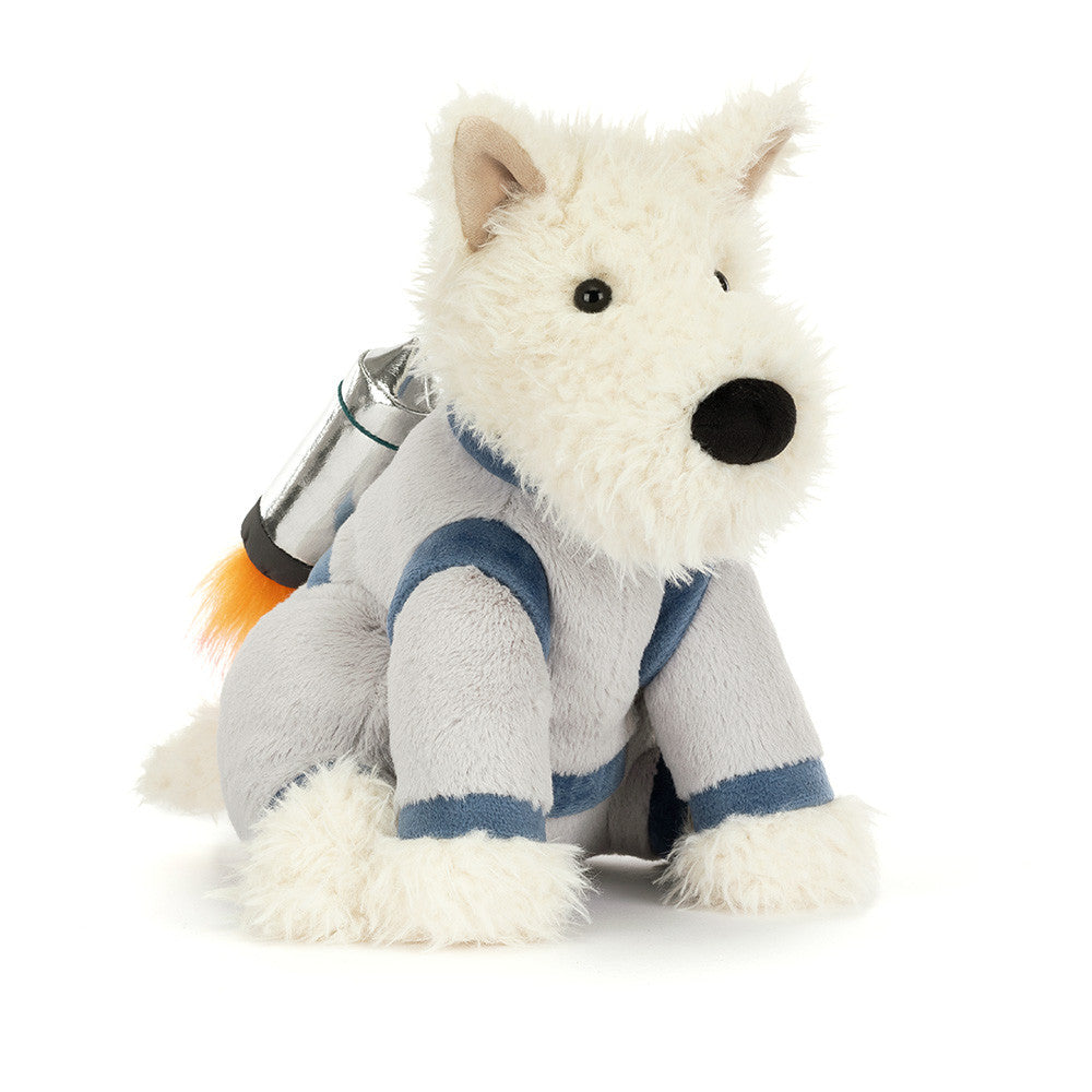 A side angled photo of a white  plush dog toy with a space-themed design outfit on a white background.