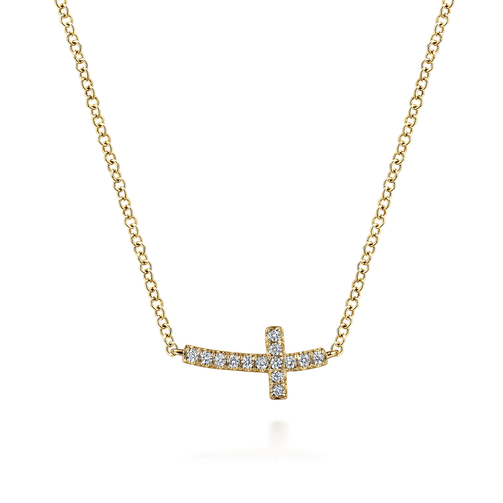 Gold necklace with a small cross pendant on a white background