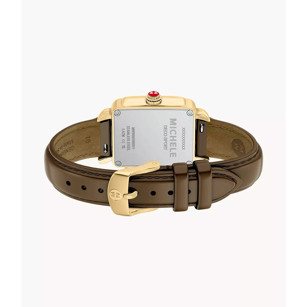 A Michele watch shown from the back, featuring a brown leather strap, a gold-tone rectangular case, and a silver-tone backplate with the brand name printed on it.