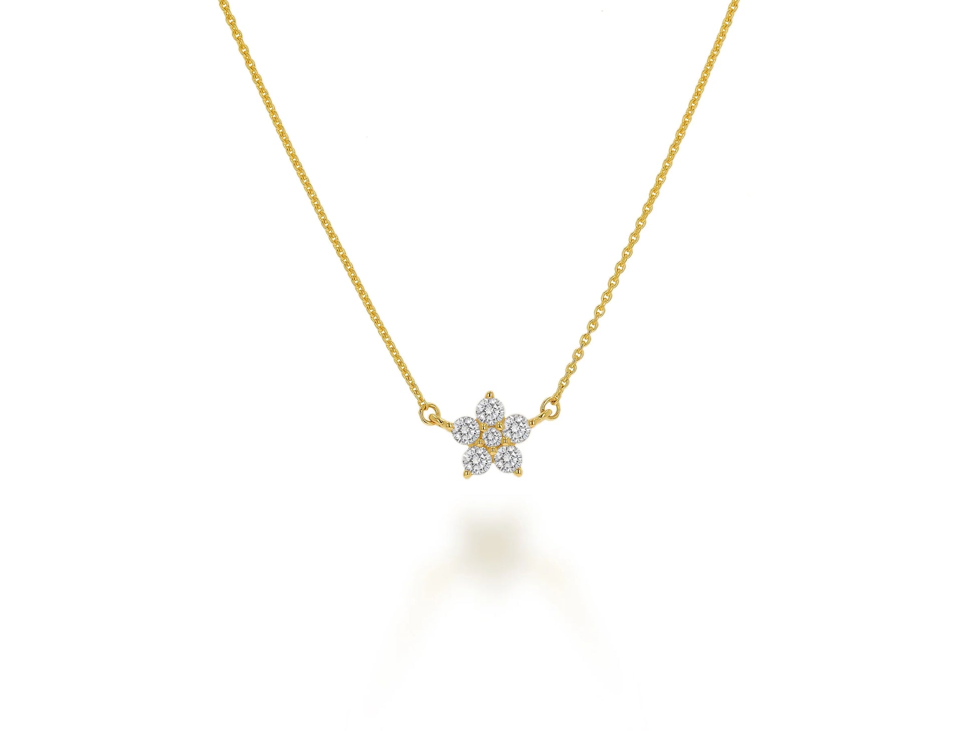 gold necklace with diamond center pendant on white background