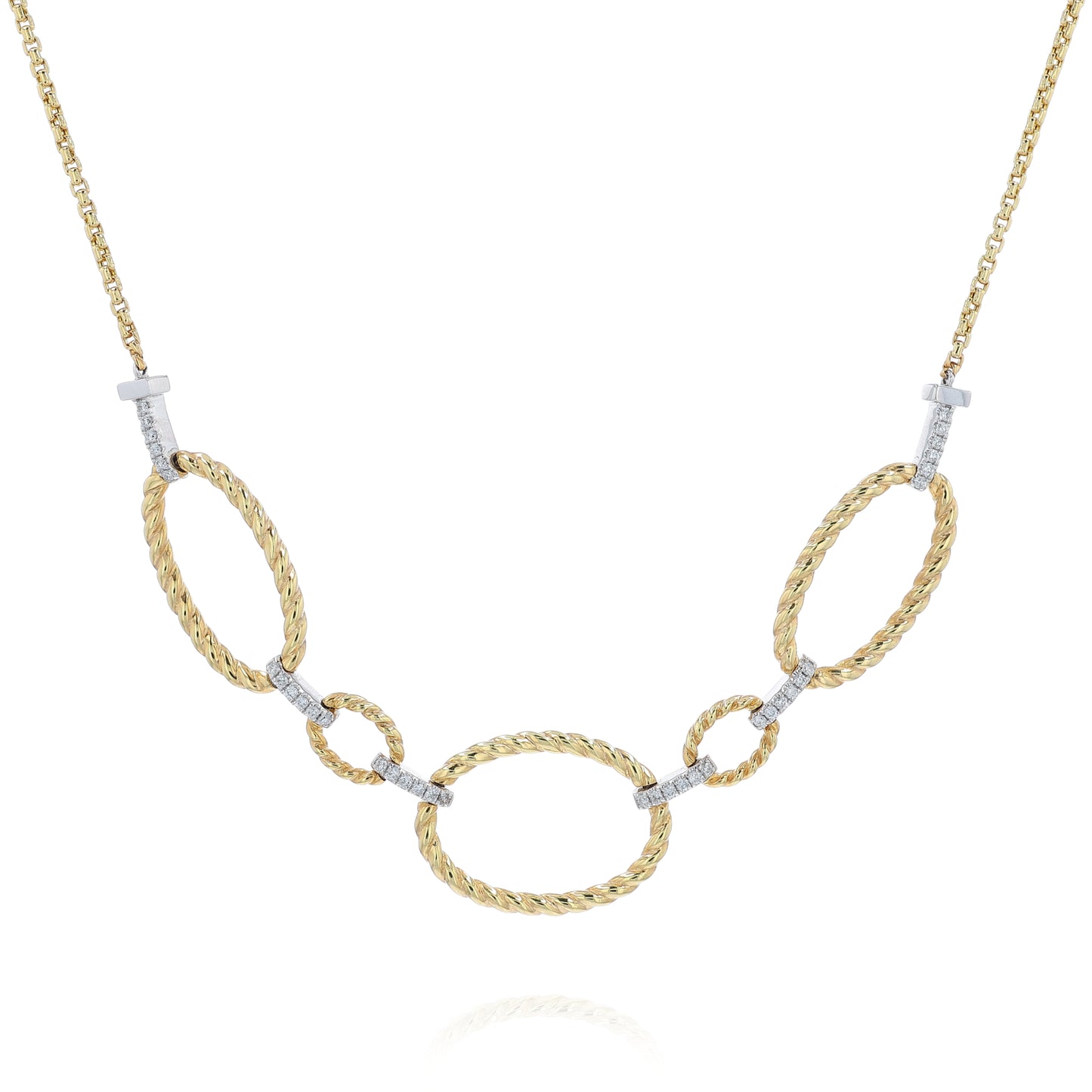 Yellow gold open oval twist link and pave diamond bar necklace on a white background