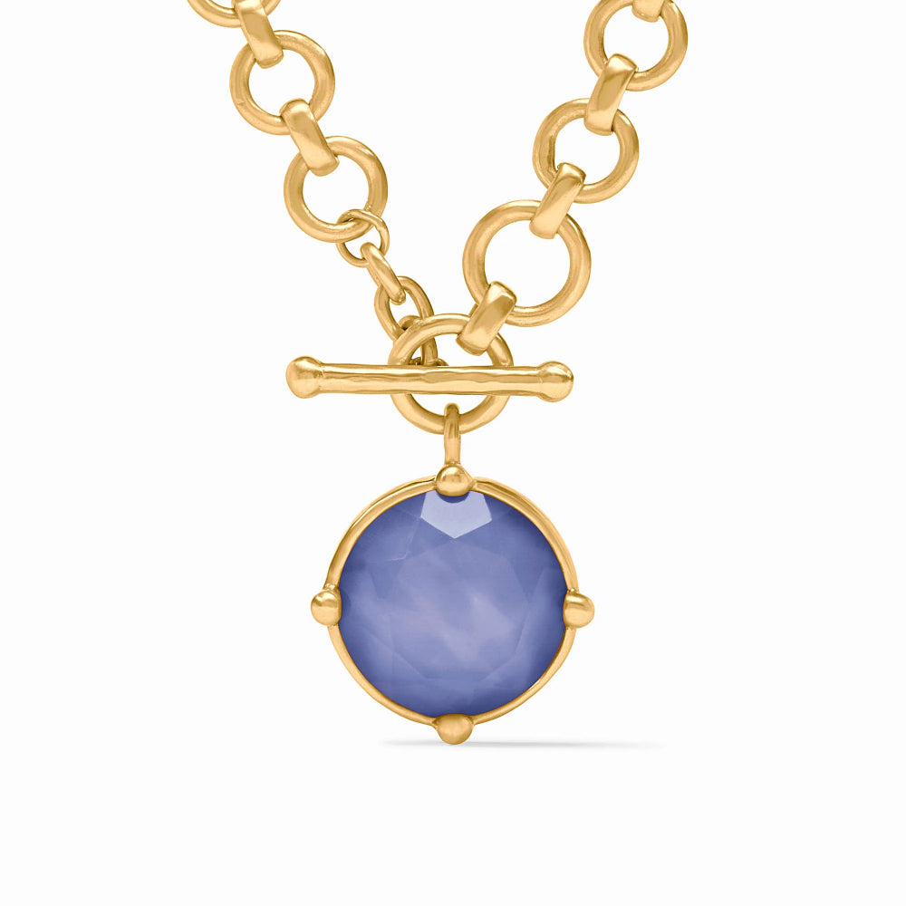 Blue pendant on gold necklace