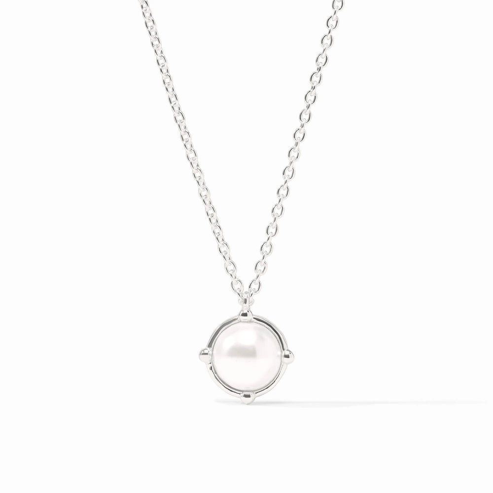 Silver necklace with a round pendant on a white background