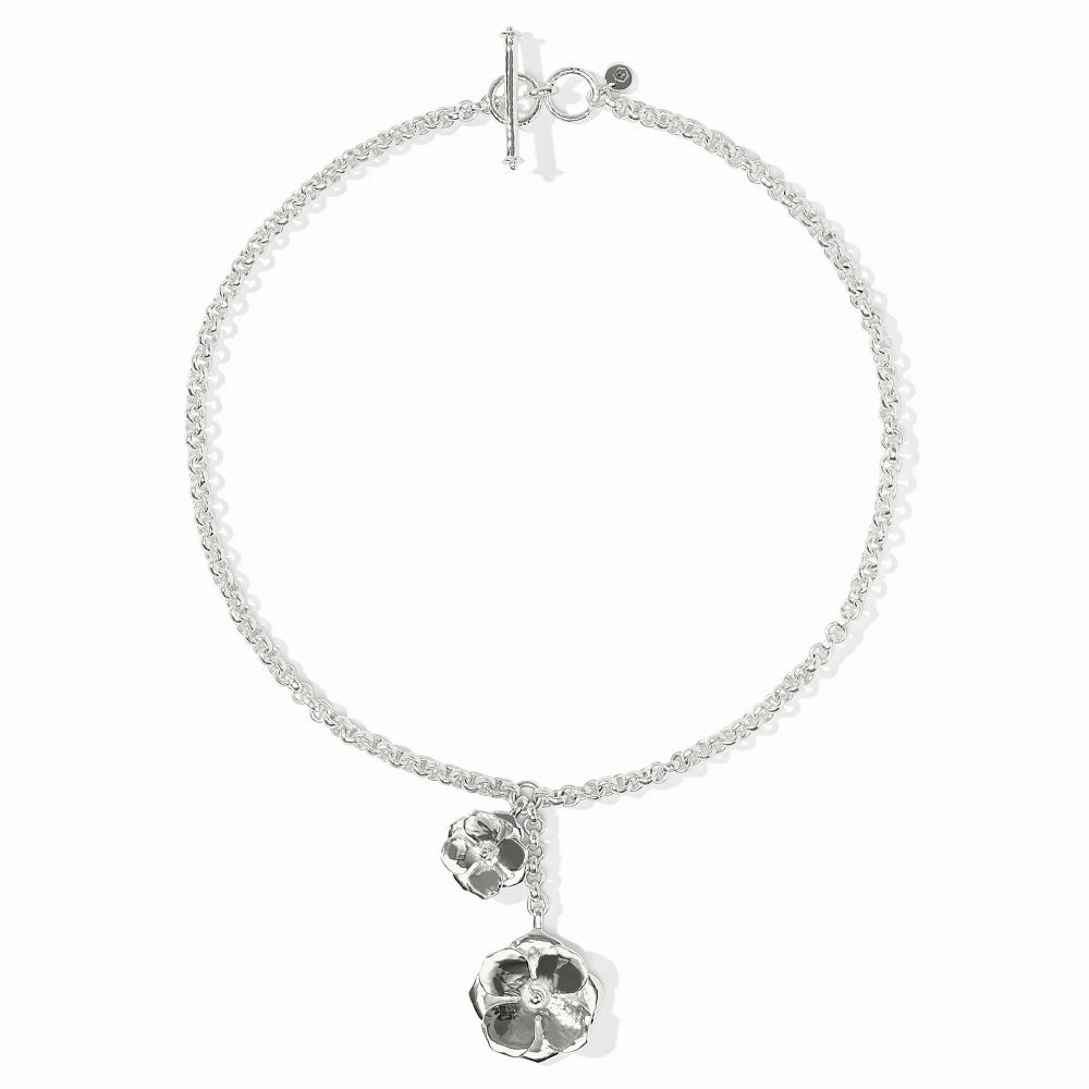 Silver necklace with floral pendant on a white background