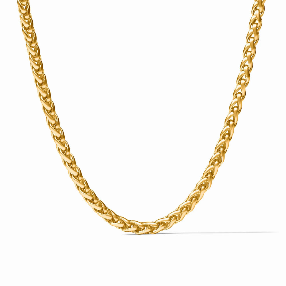 A polished yellow gold curb chain necklace displayed in a U-shape against a clean white background.