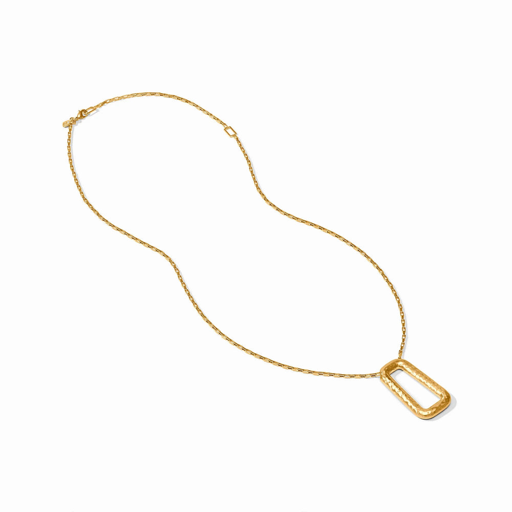 Gold necklace with a rectangular pendant on a white background