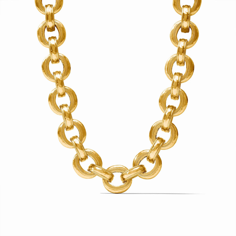 A gold chain necklace with large, polished oval links, displayed on a clean white background.