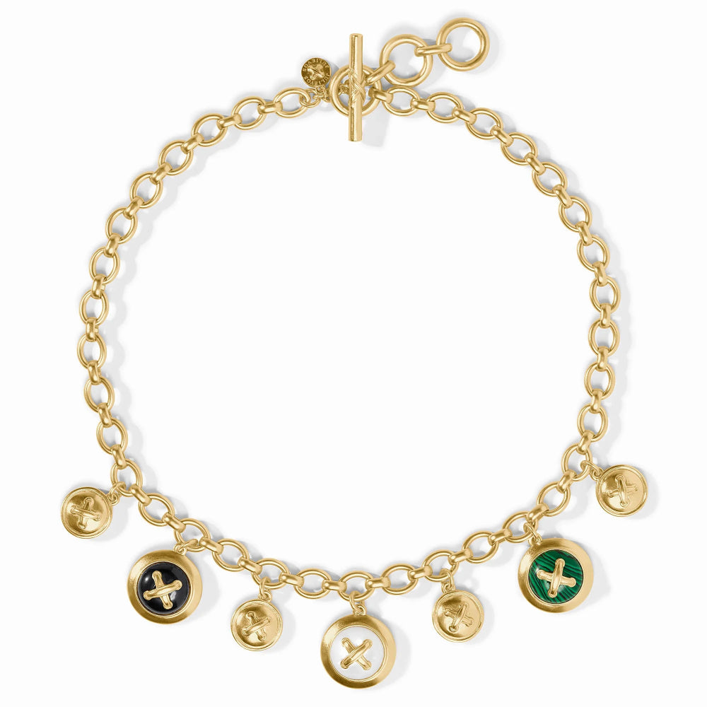 Gold bracelet with various charms on a white background