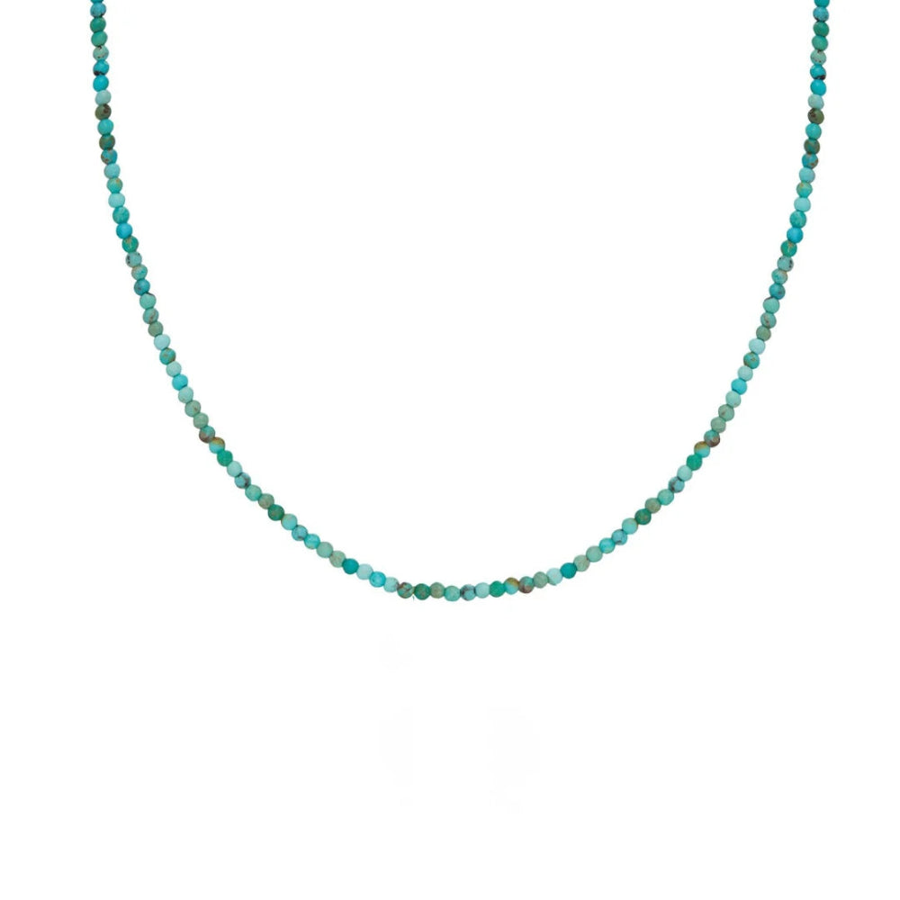 A delicate beaded necklace composed of small faceted turquoise beads