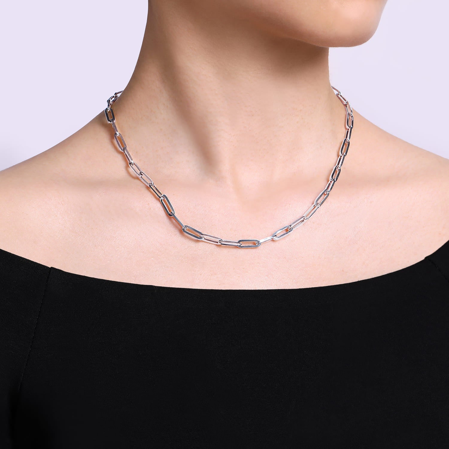 Person wearing Silver paper clip necklace 