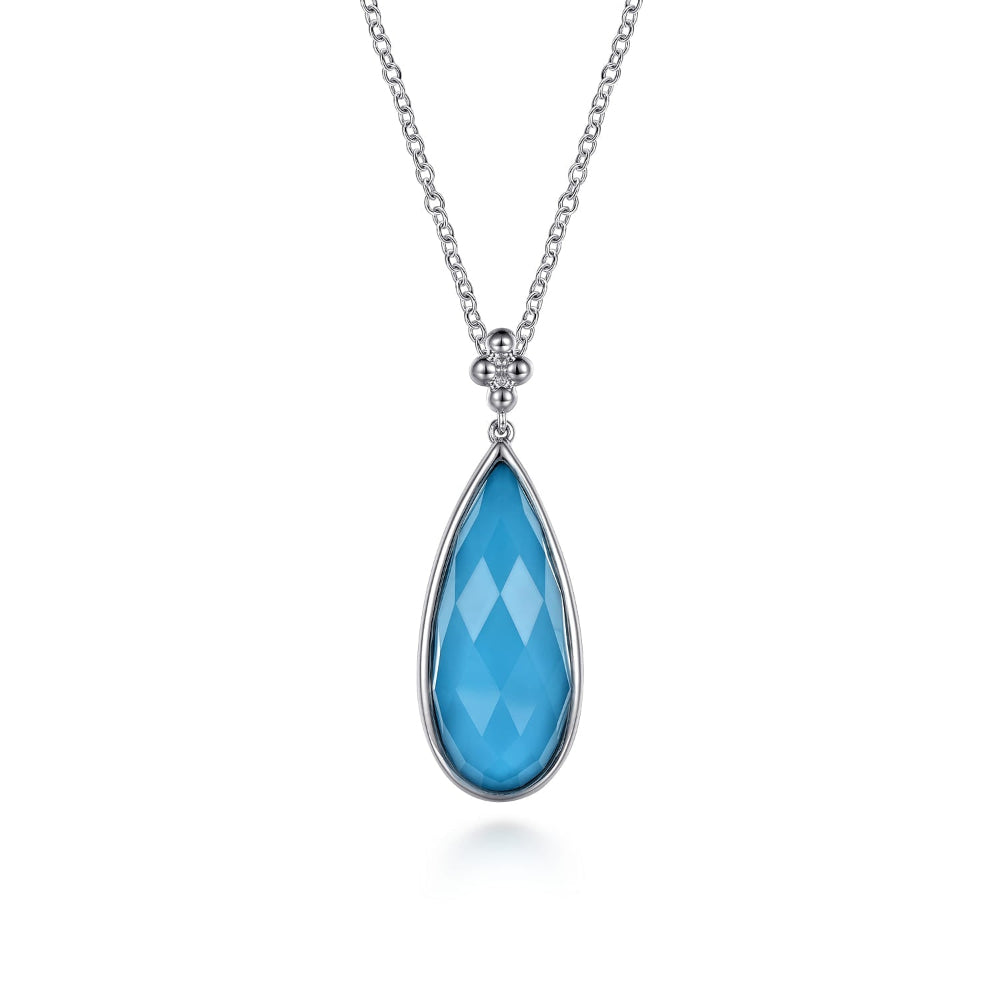 Teardrop shaped blue turquoise pendant on a silver chain 