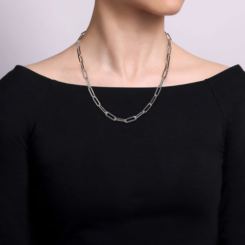 Neck of a woman wearing Sterling Silver chain necklace