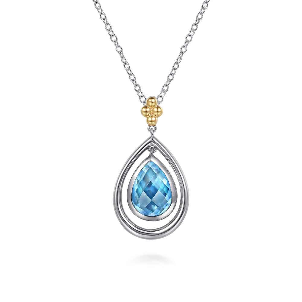Pear shaped Blue Topaz with 14k Yellow Gold accent on 24 in chain 
