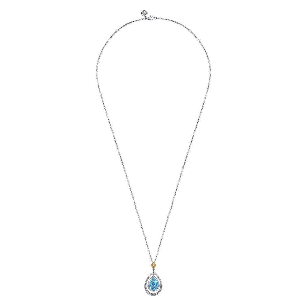 Pear shaped Blue Topaz with 14k Yellow Gold accent on 24 in chain 
