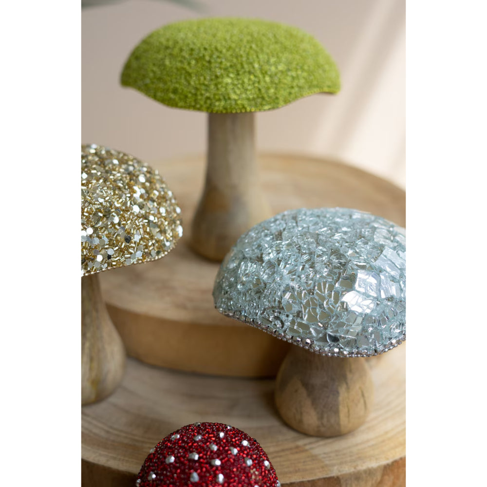 Decorative mushrooms with gemstone tops on a wooden base