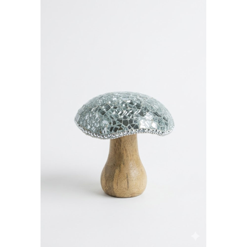 Decorative mushroom with wooden base and glass cap on a white background
