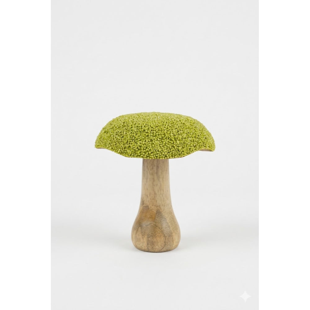 Mushroom-shaped object with green top and wooden base on a white background