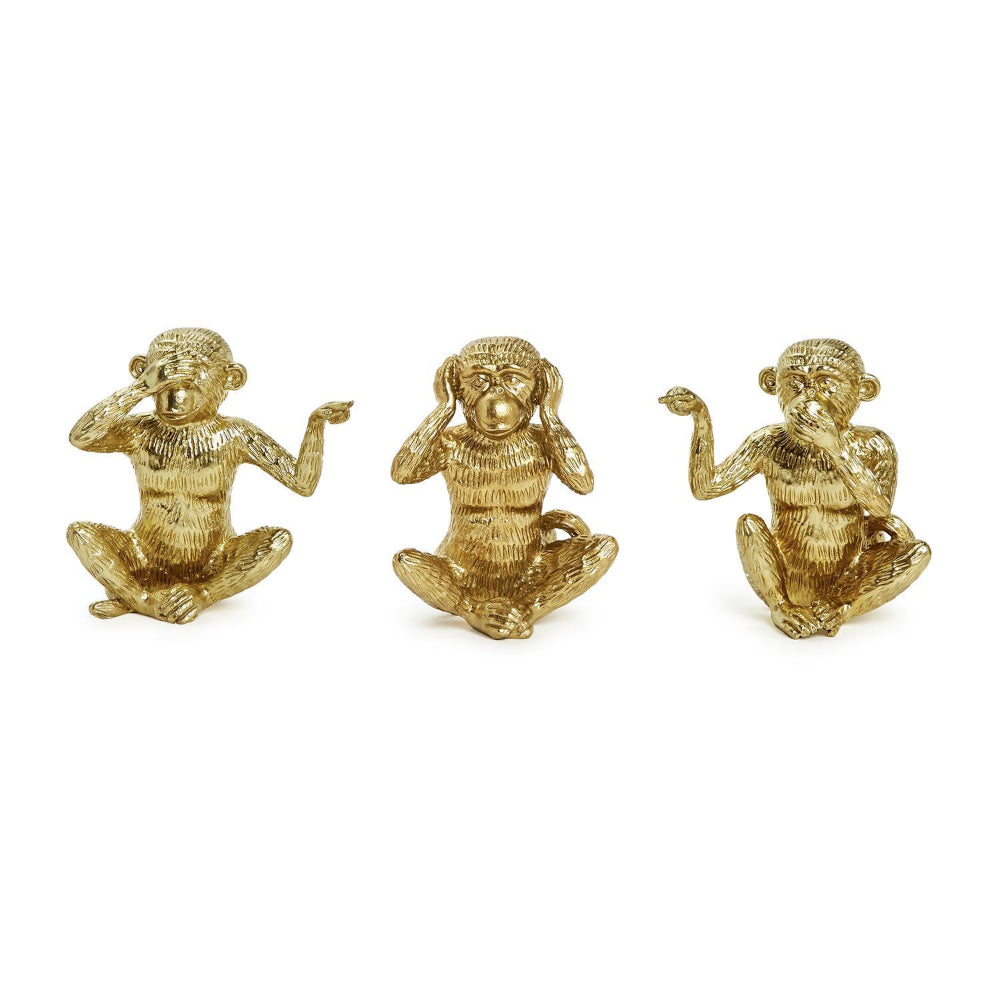Three gold monkey figurines on a white background