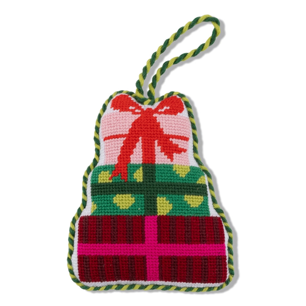 Colorful knitted presant ornament with a three wrapped gifts with a bow on a white background.