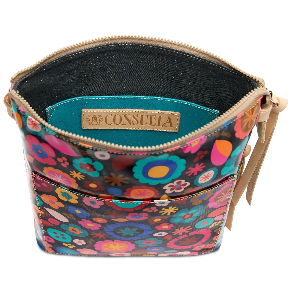 Colorful floral-patterned handbag with a visible brand label on a white background