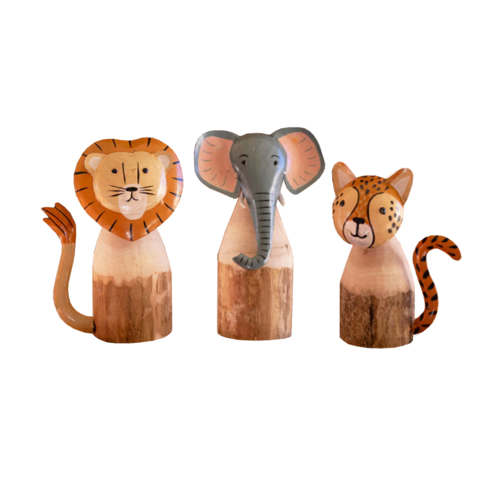 Wooden lion, elephant, and tiger figurines on a white background