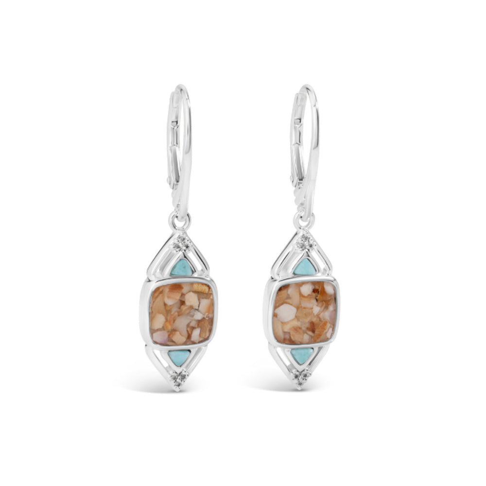 Pair of silver earrings with stone-like designs on a white background