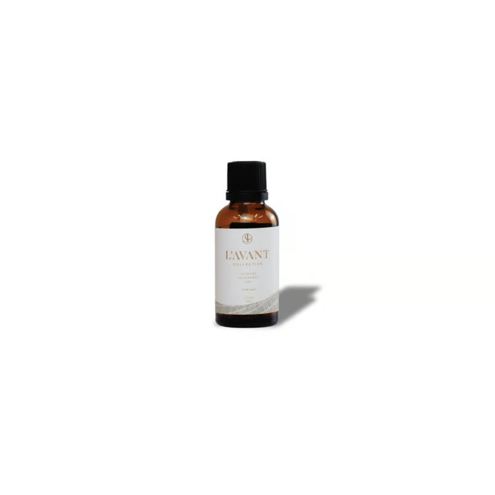 A small amber glass bottle with a black cap and a white label reading LAVALANT, centered on a plain white background with a soft shadow to the right.