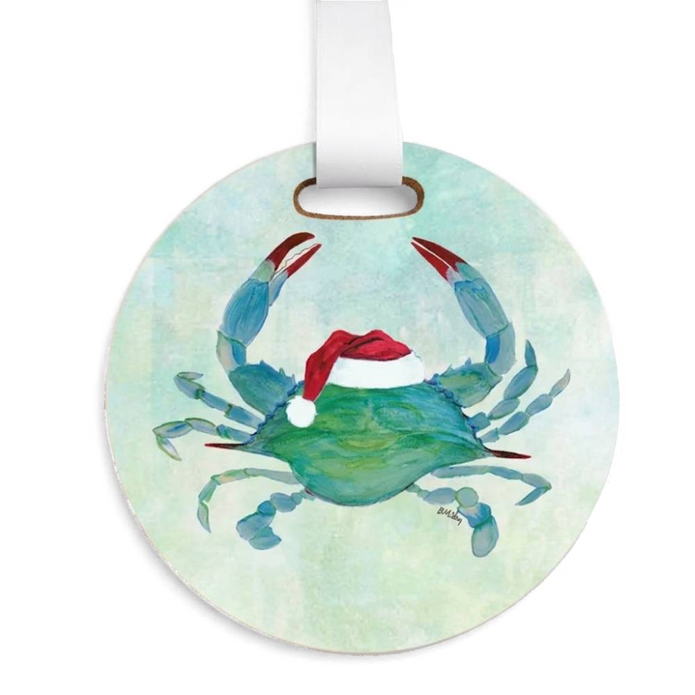 Round plastic Christmas ornament featuring a painted blue crab with a red Santa hat, hanging from a white ribbon on a white background.