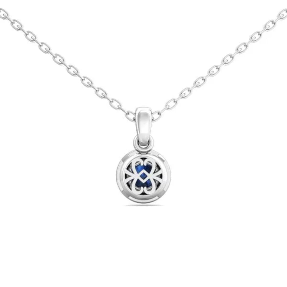 White gold necklace with a round blue sapphire center and surrounding diamond halo on a white background