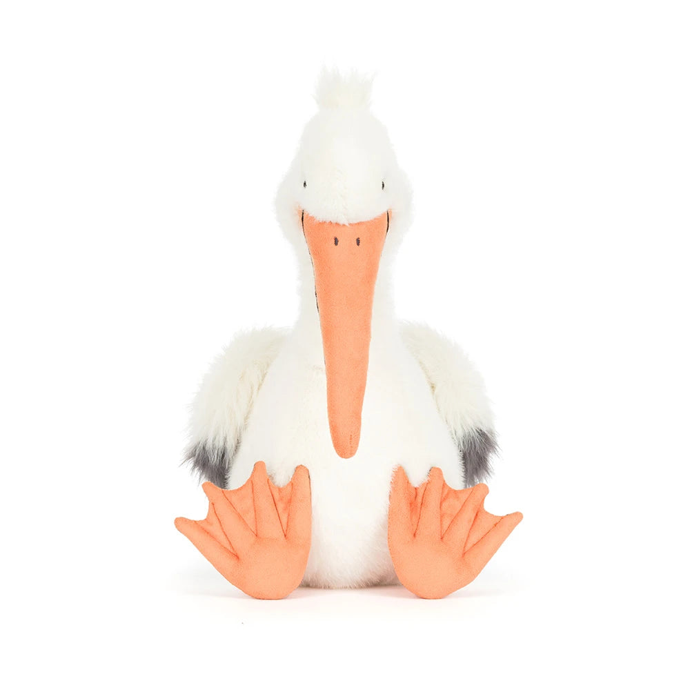An Keli Pelican stuffed animal with a white and grey body and orange beek and legs on a white backround. 