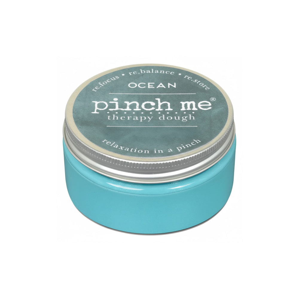 Turquoise jar of Ocean 'pinch me' therapy dough with a silver lid on a white background.