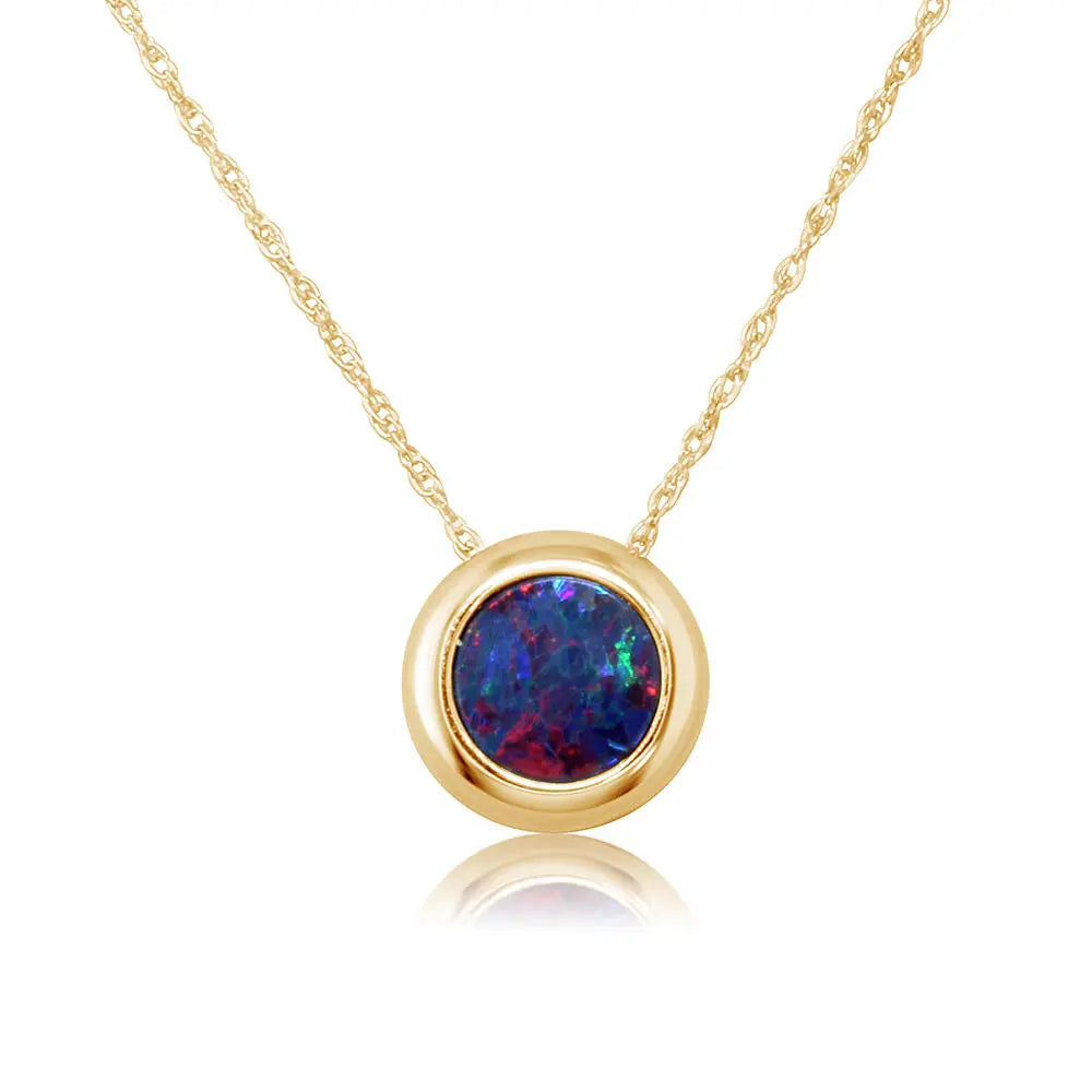 Gold necklace with a round opal pendant on a white background
