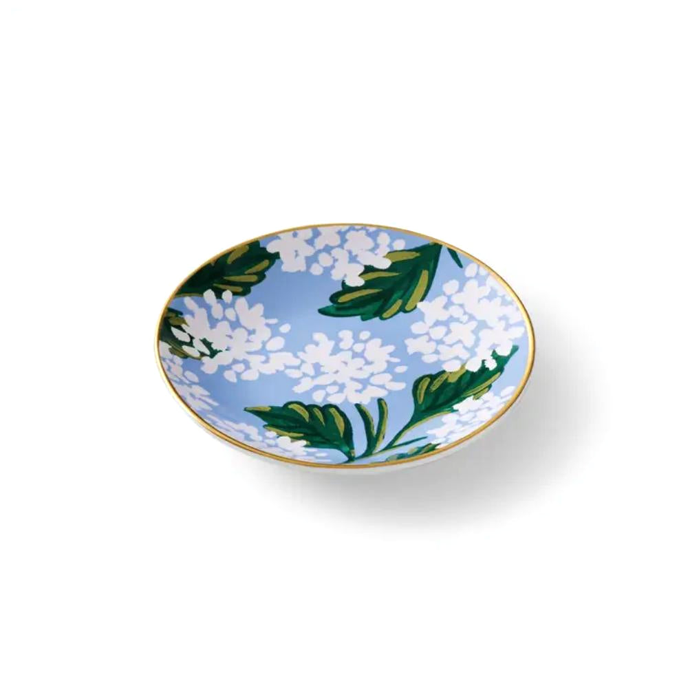 Decorative ring dish with a white hydrangea floral design on a blue base  color on a white background.