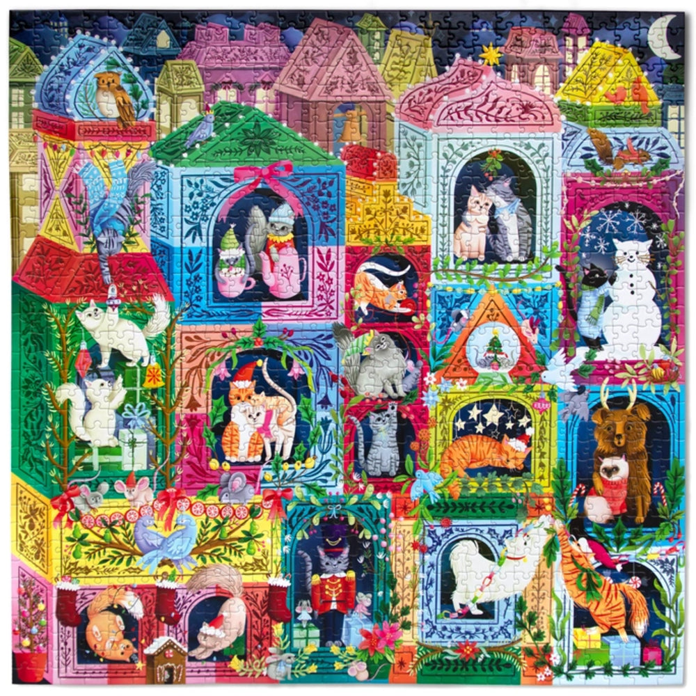 A colorful jigsaw puzzle featuring whimsical illustrated cats in ornate house-shaped frames, with a dark blue night sky and moon in the background.