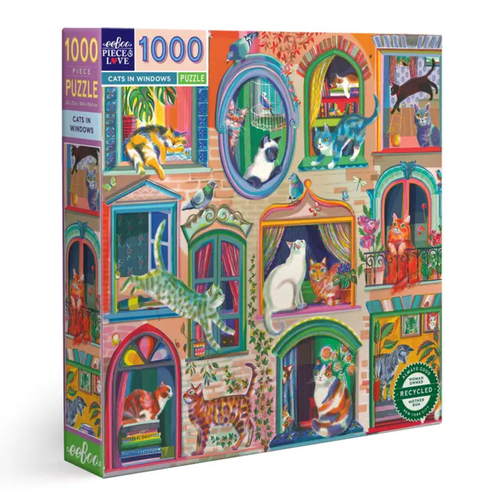 Jigsaw puzzle box with colorful illustration of cats in windows