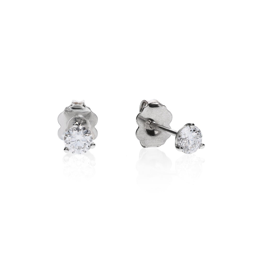 White gold 3 prong martini set diamond studs on a white background
