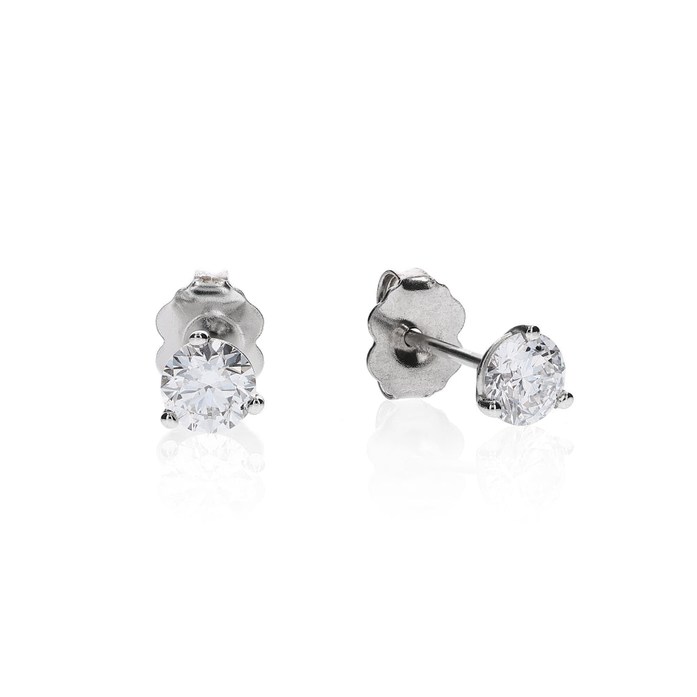 White gold 3 prong martini set diamond studs on a white background