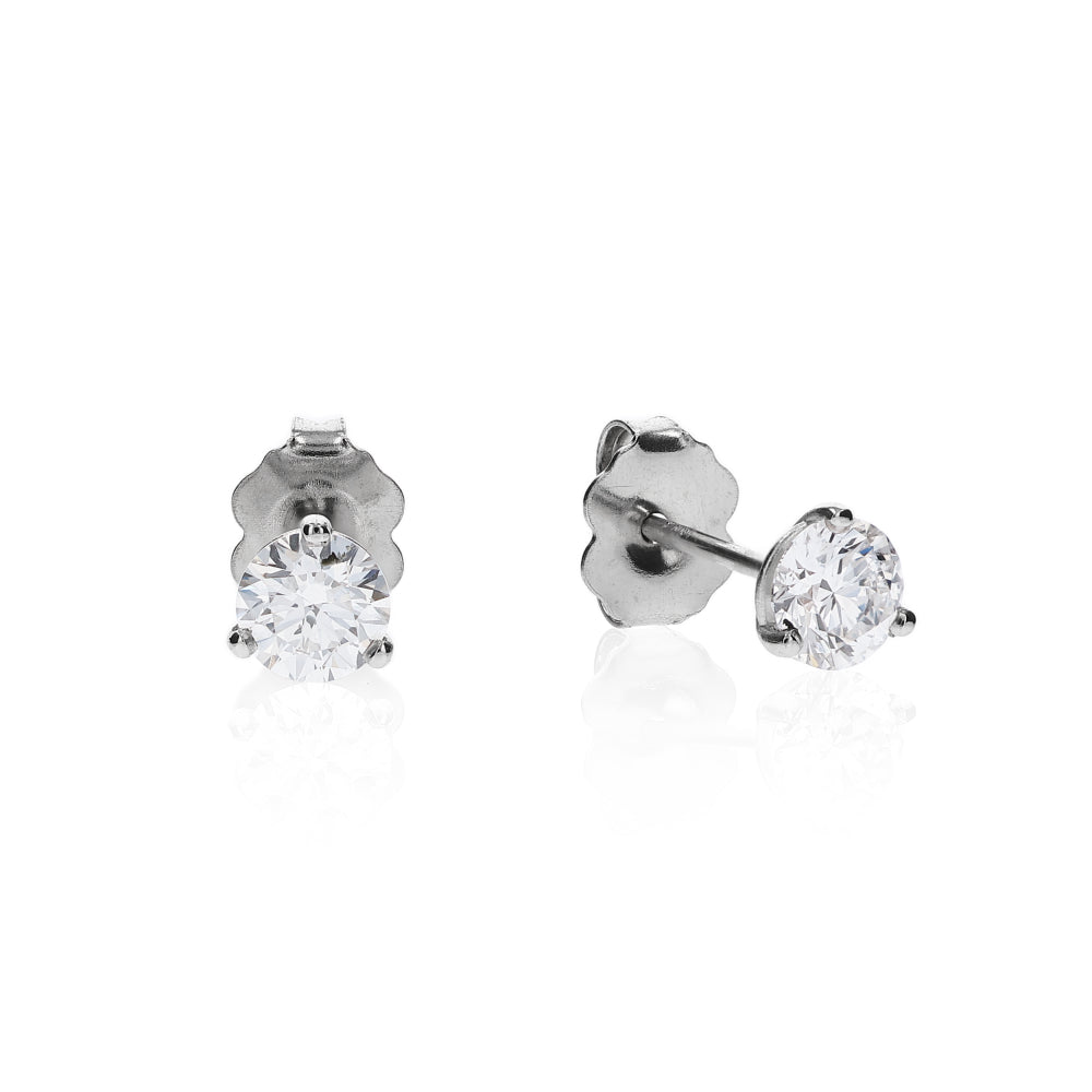 White gold 3 prong martini set diamond studs on a white background